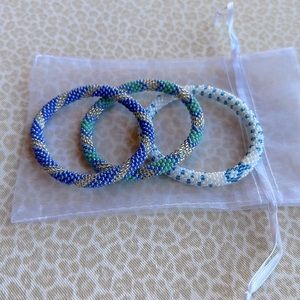NWOT Aid Through Trade Roll-On Glass Bead Bracelets